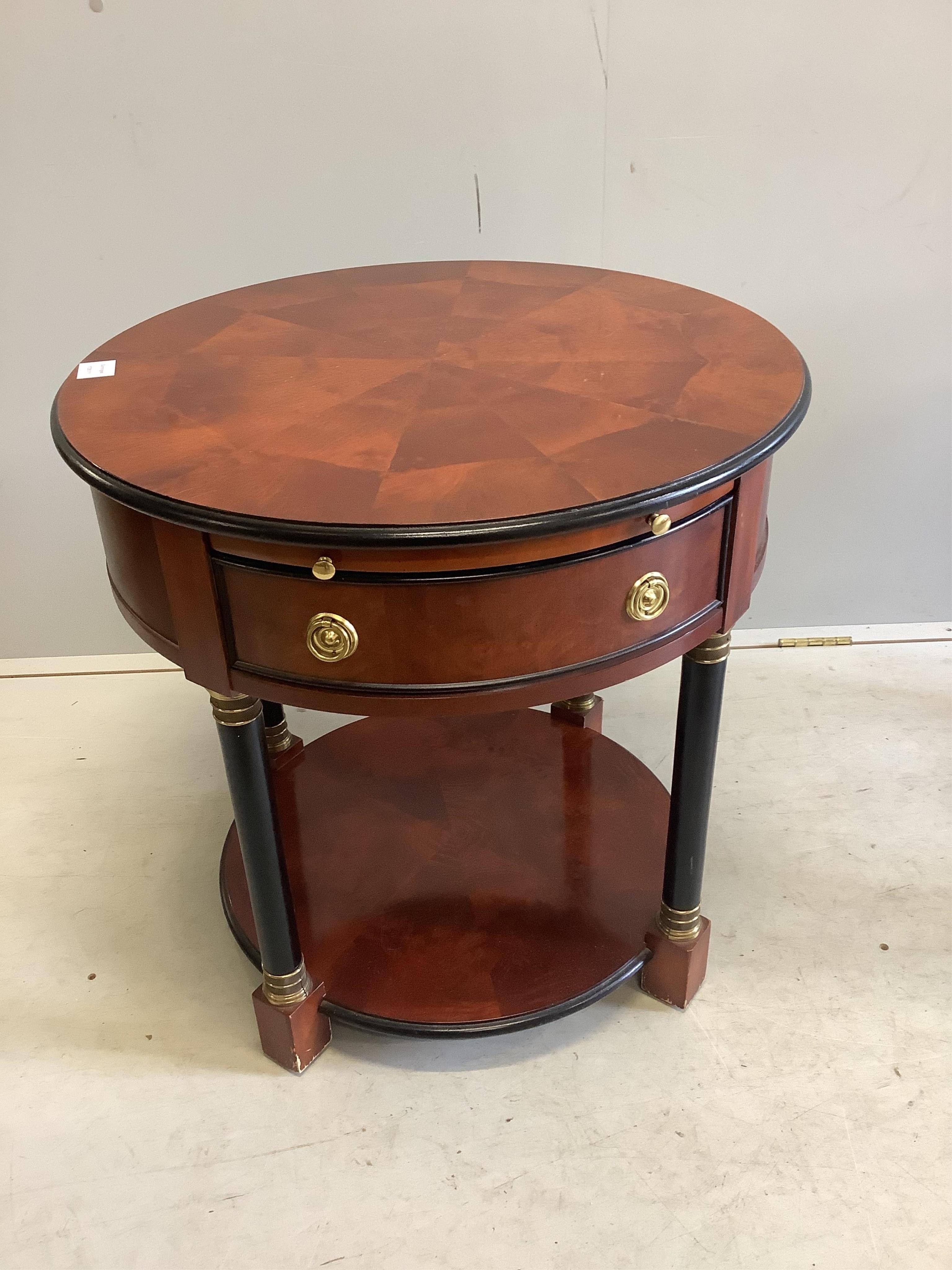 A pair of French Empire style mahogany and ebonised two tier circular tables, diameter 65cm, height 54cm. Condition - fair